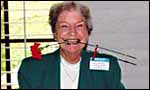 Photo of lady with carnation in mouth